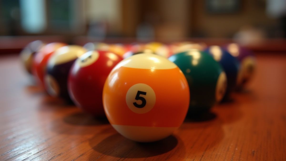 Billiard balls on a polished wooden table.