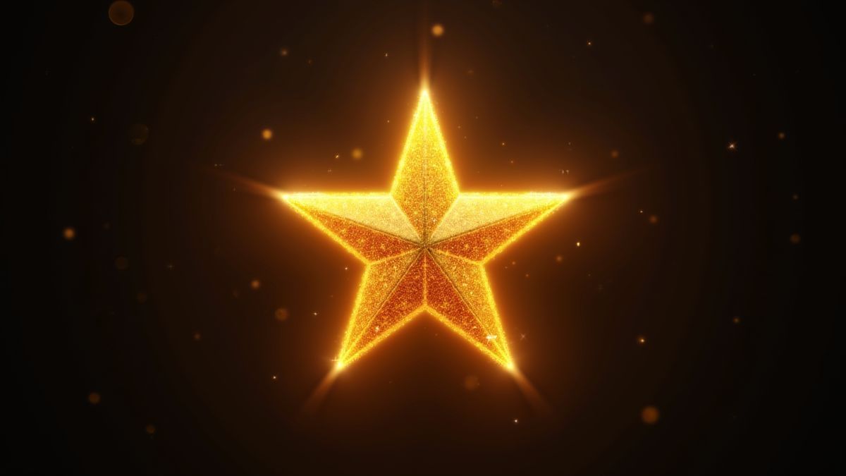 Estrela dourada brilhando em um fundo escuro.