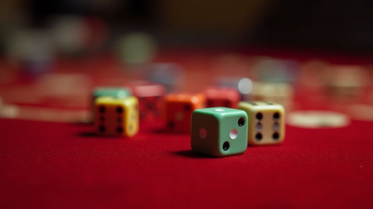 Colorful dice on a velvet casino table.