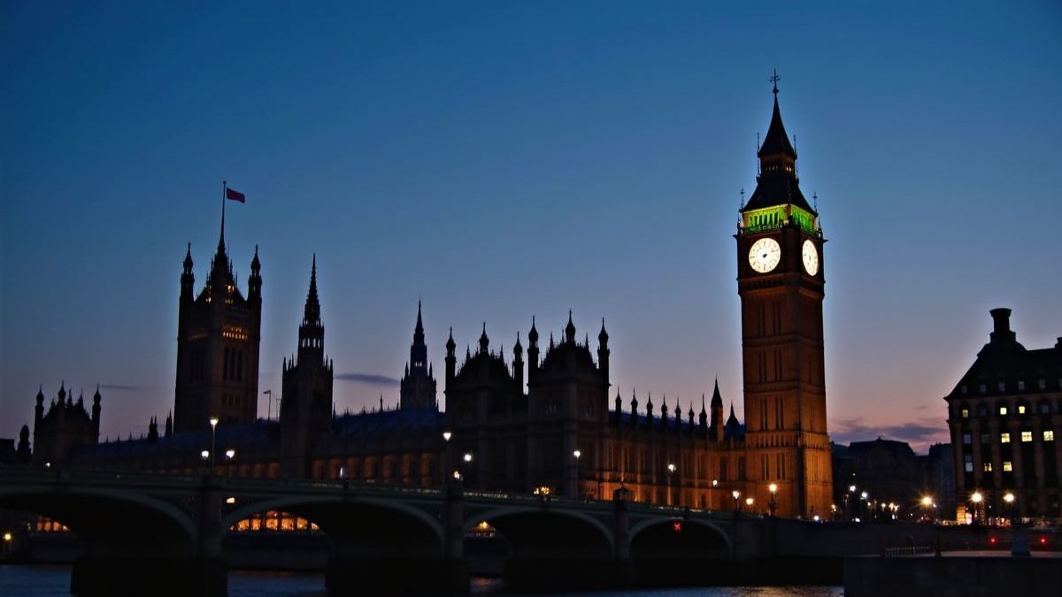 Big Ben illuminated at sunset with neon lights.