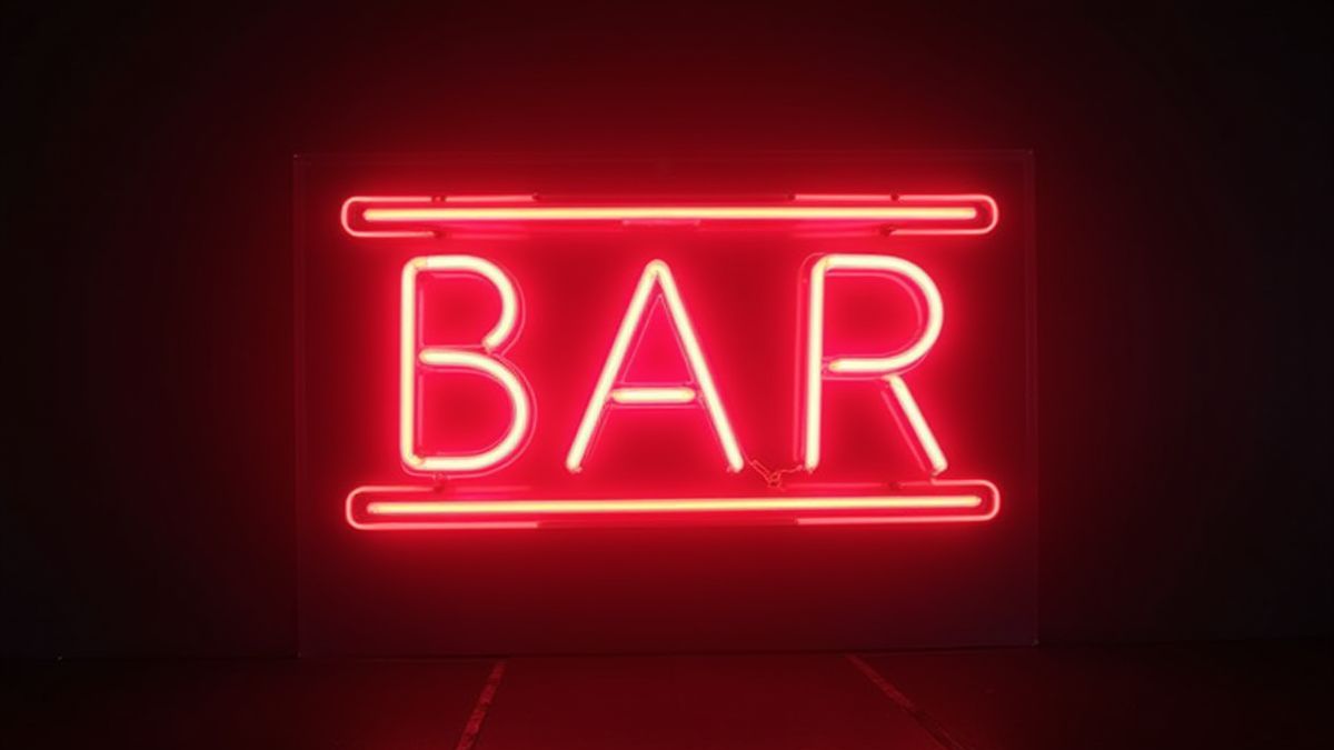Un cartel de BAR con estética retro y luces de neón.